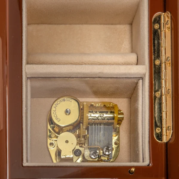 Close-up of gold-plated 18-note musical movement inside Ercolano "London's Autumnal Dream" music box – precision Swiss-style mechanism